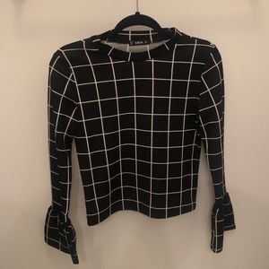 Black and white she in work top